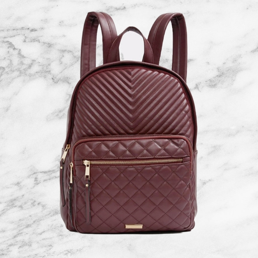 Burgundy quilted backpack with gold hardware
